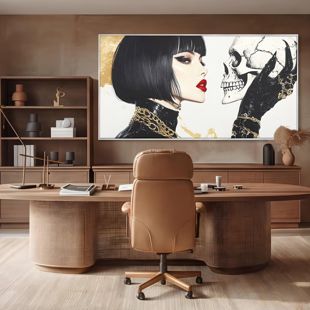 Tablou canvas cu ilustratie digitala cu femeie si craniu, in rama de aluminiu argintiu, pe perete intr-un birou